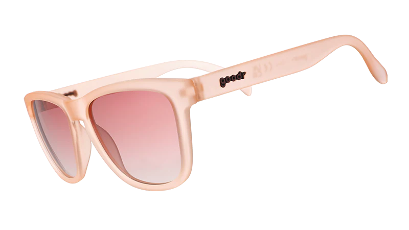 Pink square-shaped sunglasses with pink gradient lenses.
