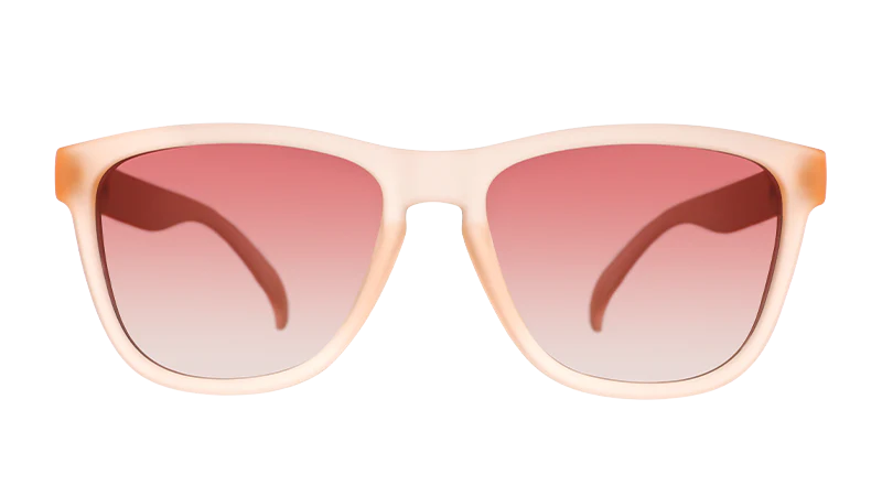 Pink square-shaped sunglasses with pink gradient lenses.