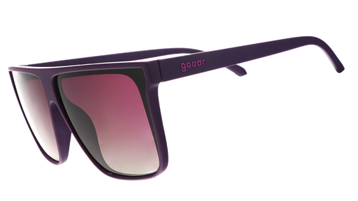 Oversized flat-top dark purple sunglasses with gradient lenses.