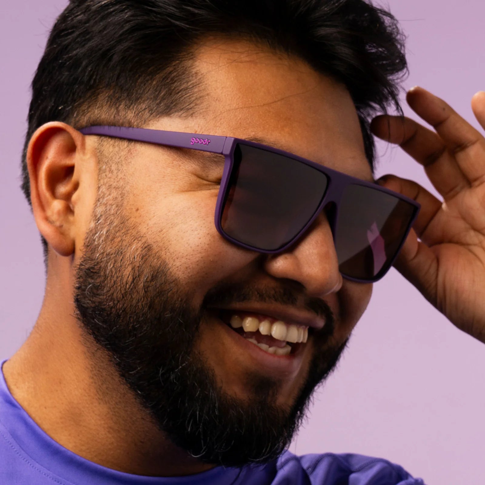 Style and fit showcase of oversized flat-top dark purple sunglasses with gradient lenses.