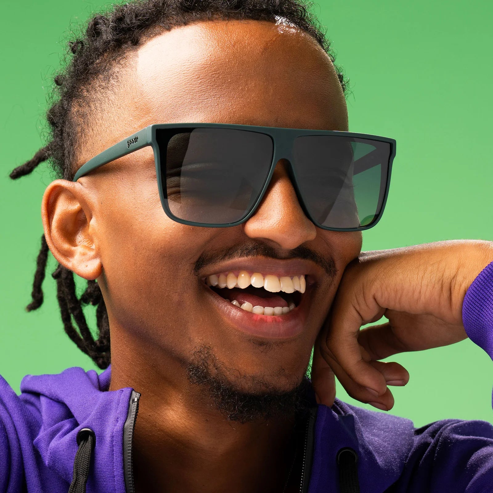 Style and fit showcase of dark green oversized flat-top sunglasses with gradient lenses for better ground visibility.